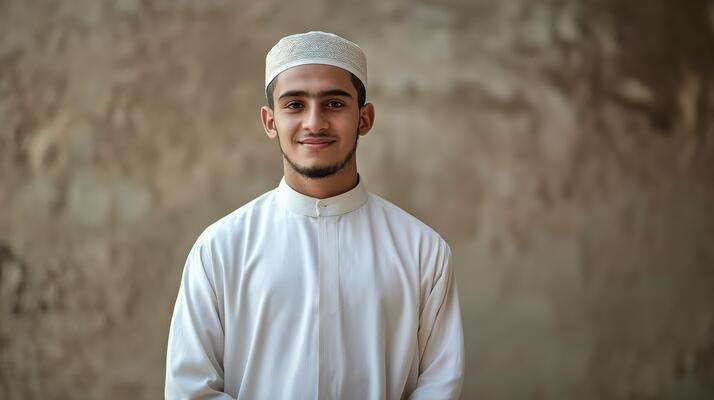 young-sunni-muslim-cleric-smiling-confidently-in-traditional-white-attire-against-rustic-background-photo